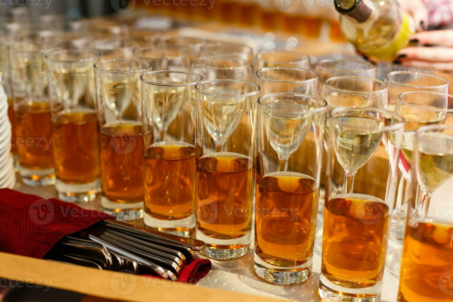 Restaurant serving, glasses with wine and juice in a row photo