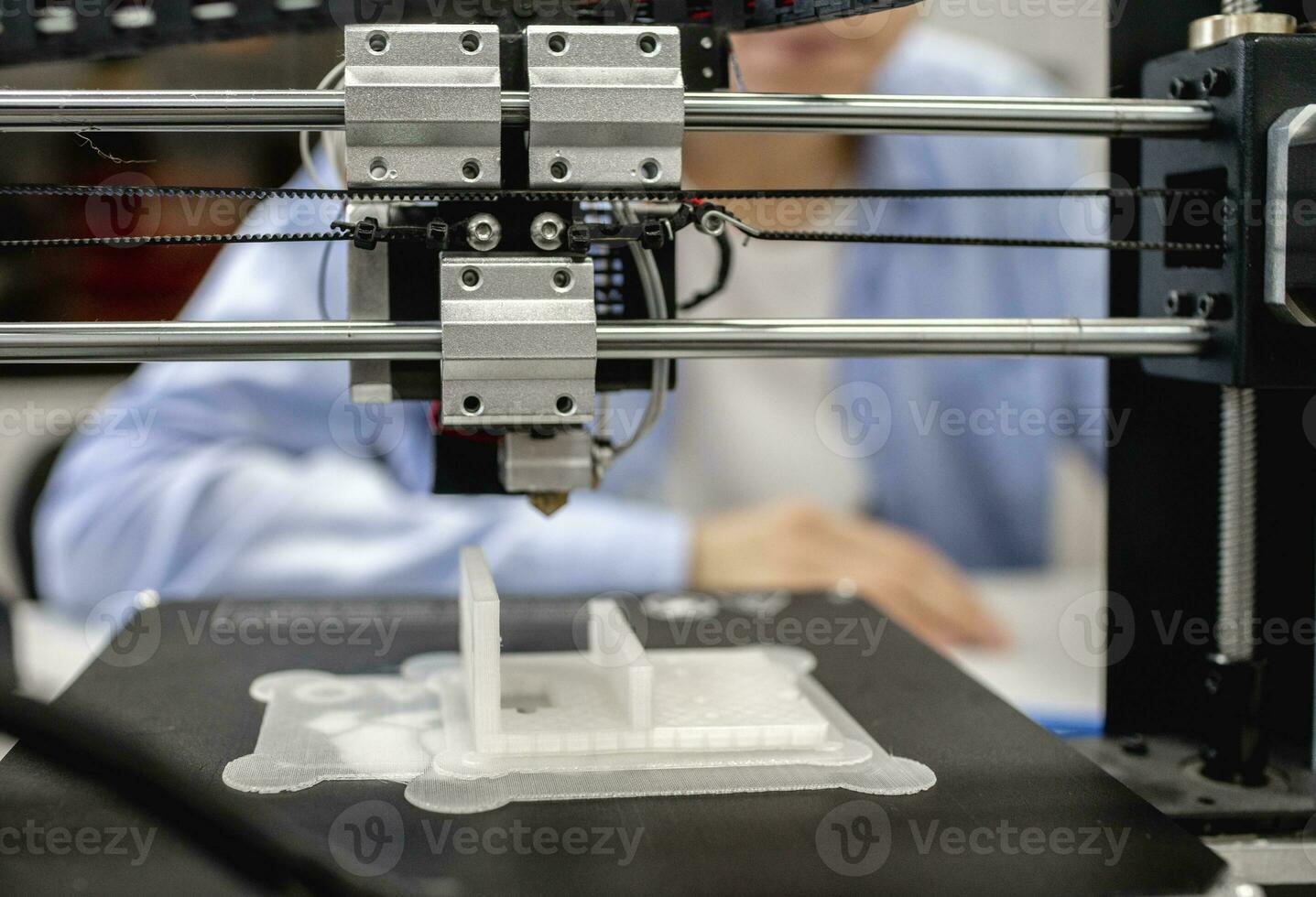 Student printing components with 3D printer, close up photo