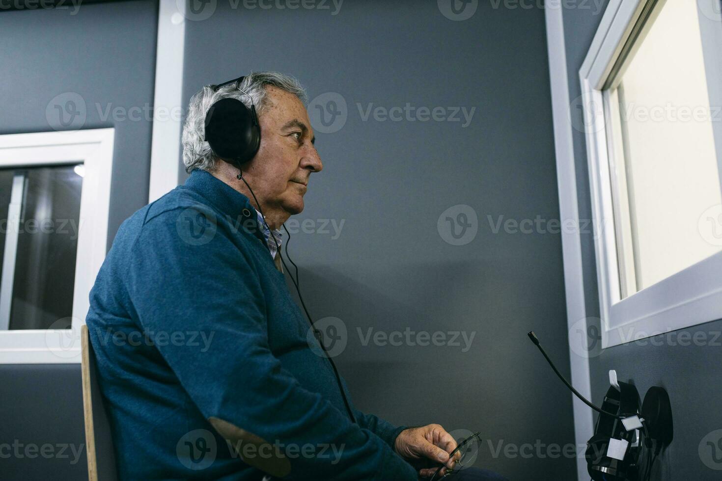 Patient with headphones during a hearing test photo