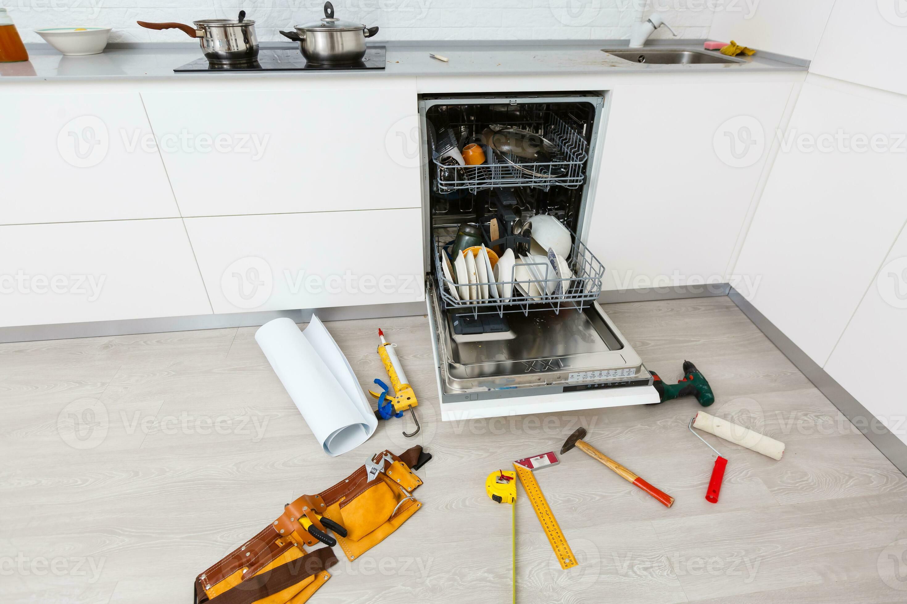 A broken dishwasher with lots of suds on the bottom but missing the