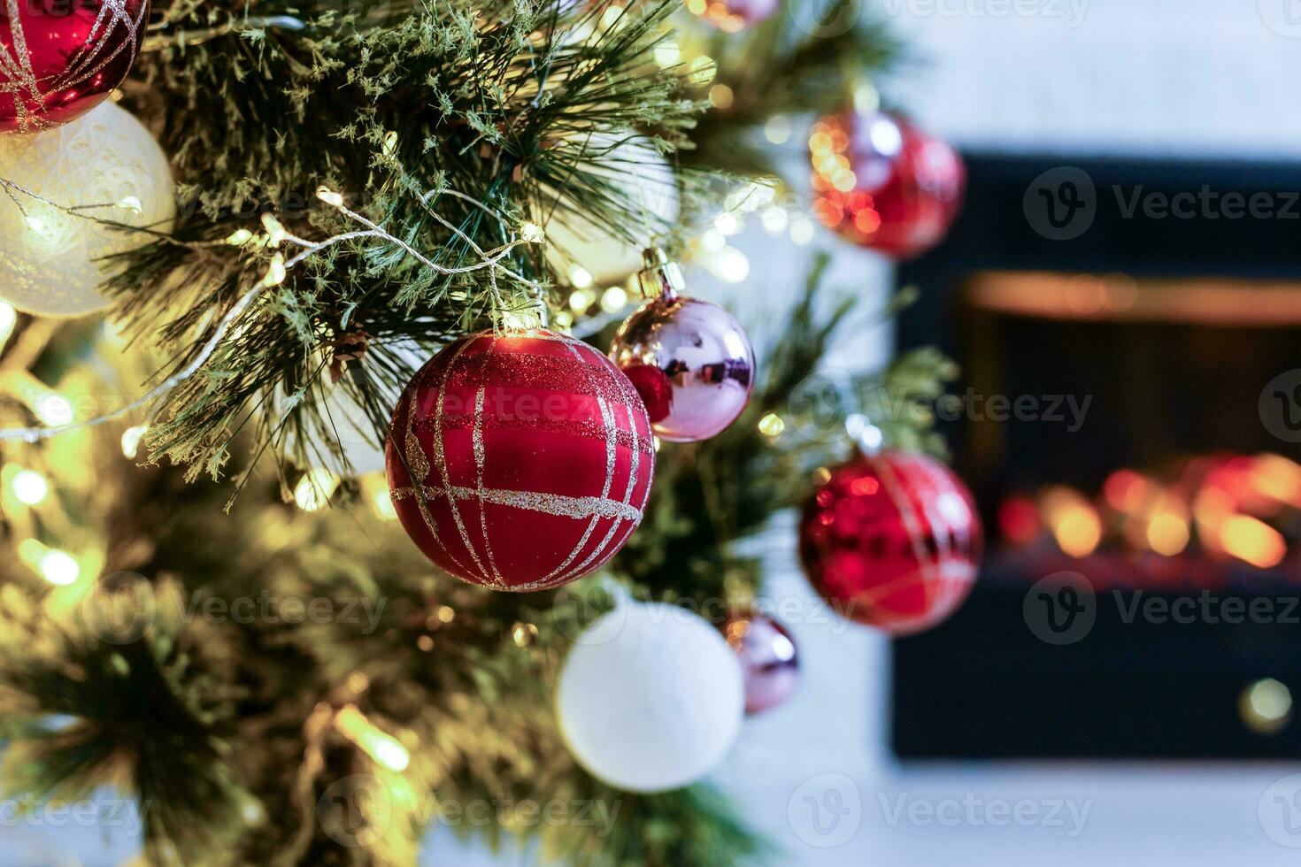 Decorated Christmas tree on blurred, sparkling and fairy background photo