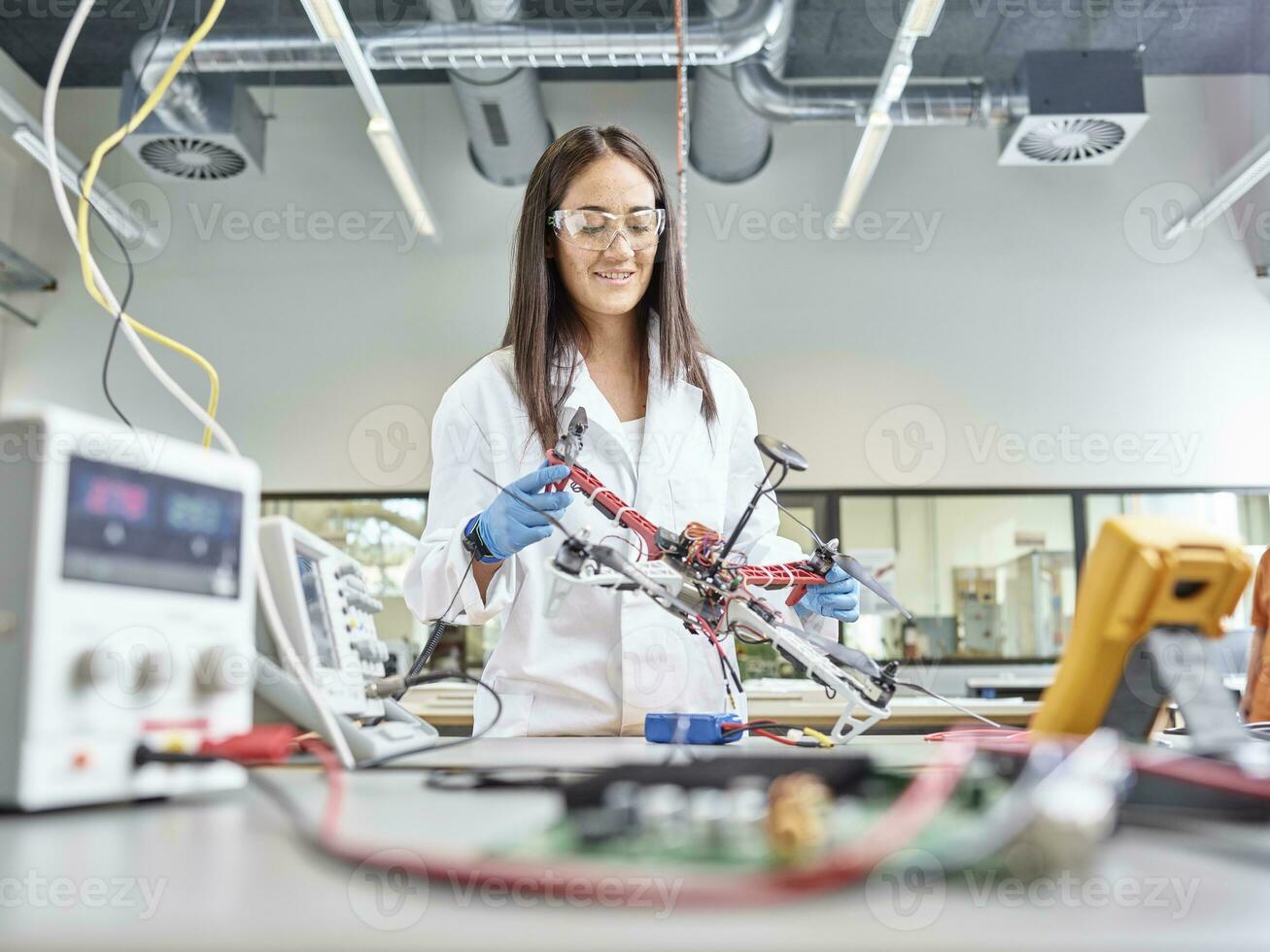 Female technician working in research laboratory, developing drone photo