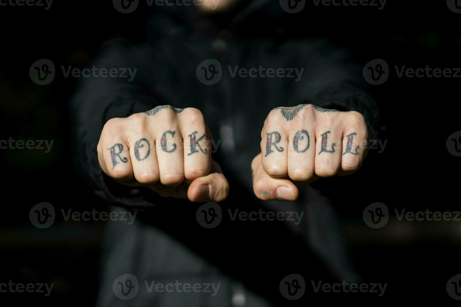 Man showing his tattooed hands, close-up photo