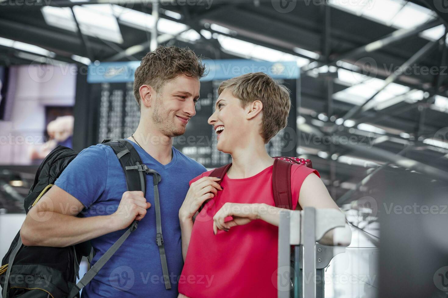 Happy couple at the airport photo