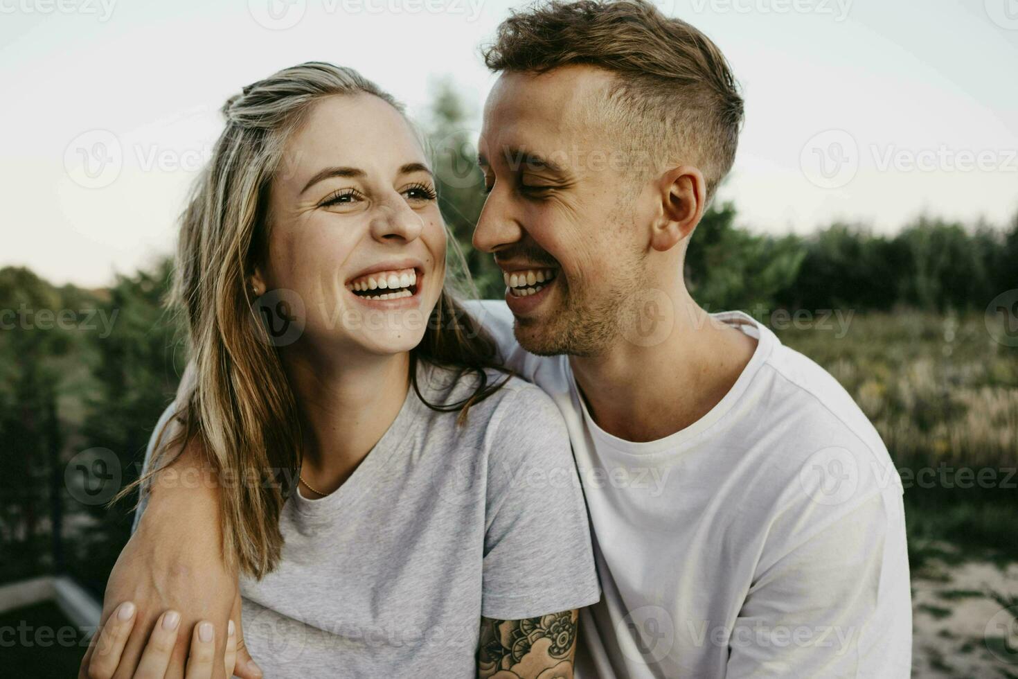 Portrait of young laughing couple photo