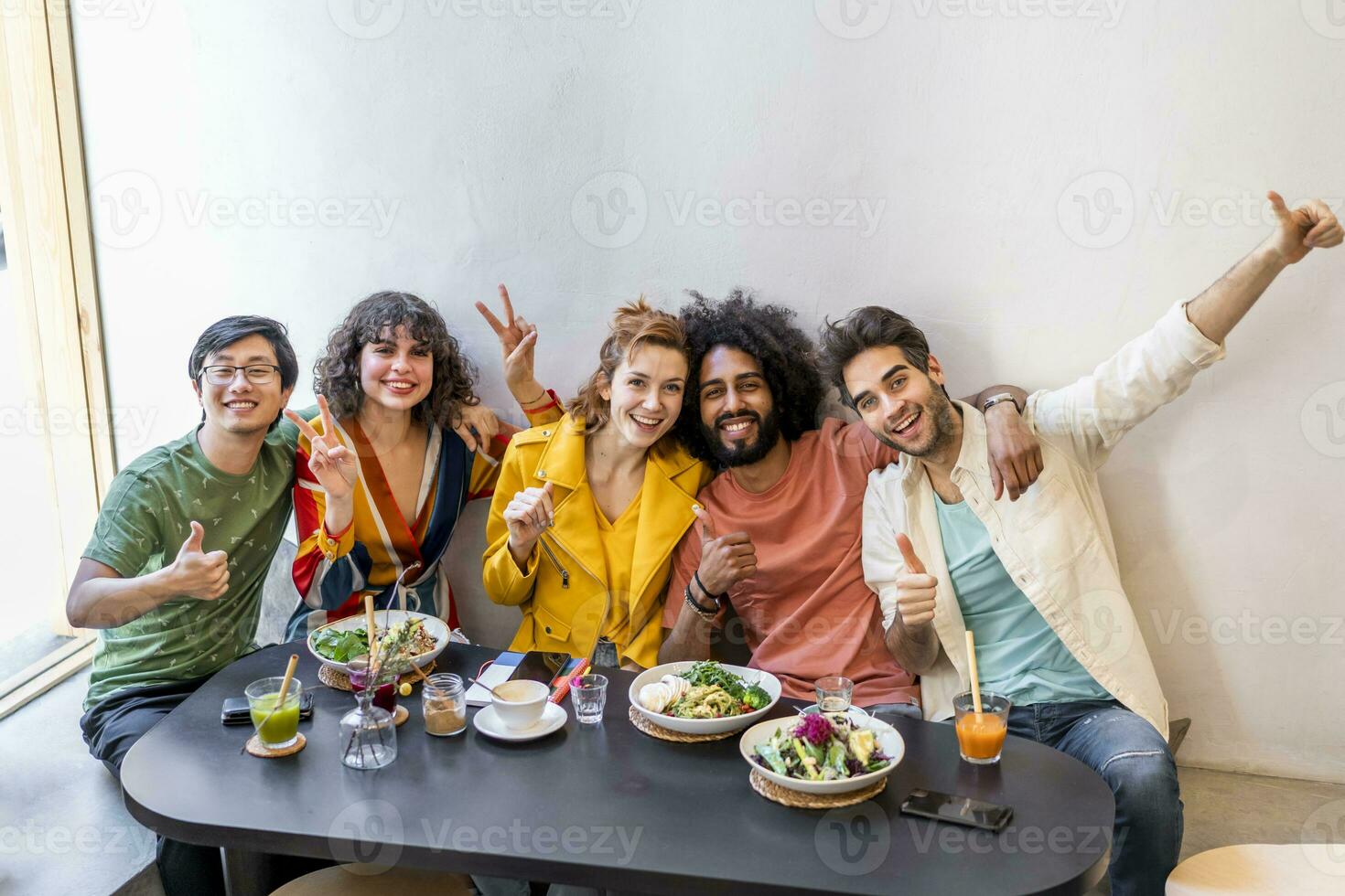 Portrait of happy group of friends in a restaurant photo