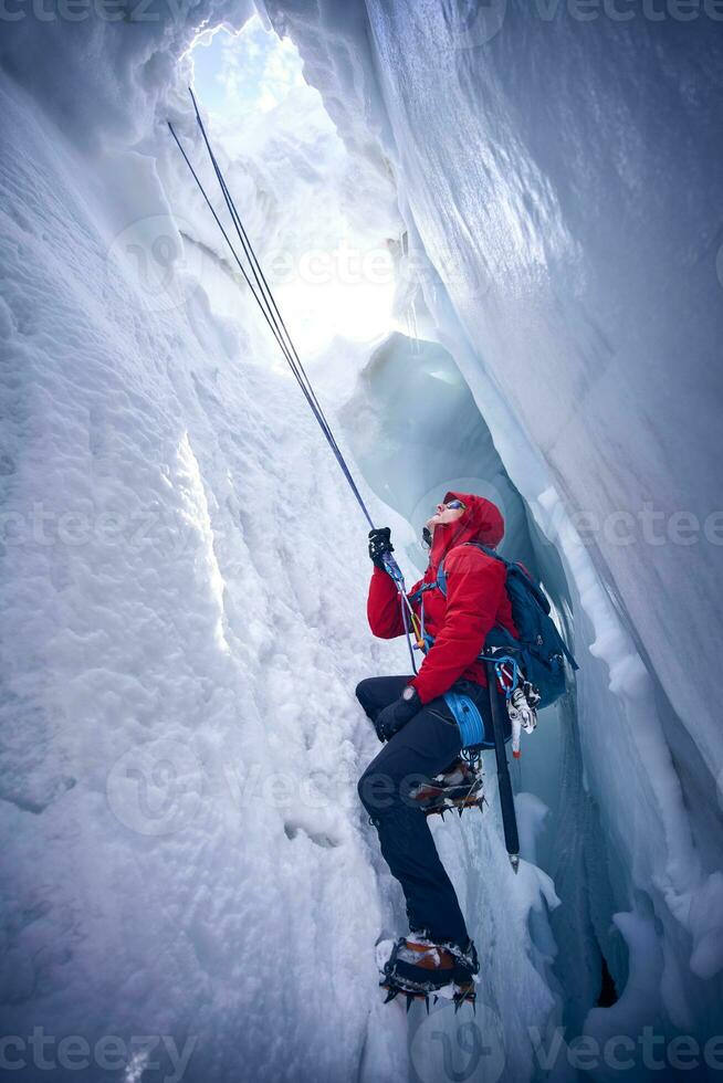 Mountaineer climbing in crevasse, Glacier Grossvendediger, Tyrol, Austria photo