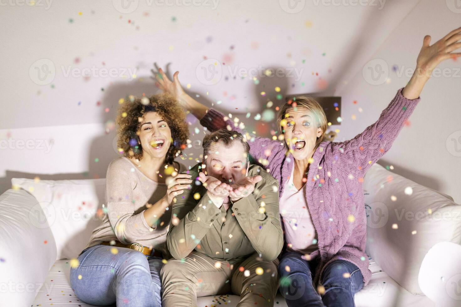 Best friends celebrating party with confetti photo