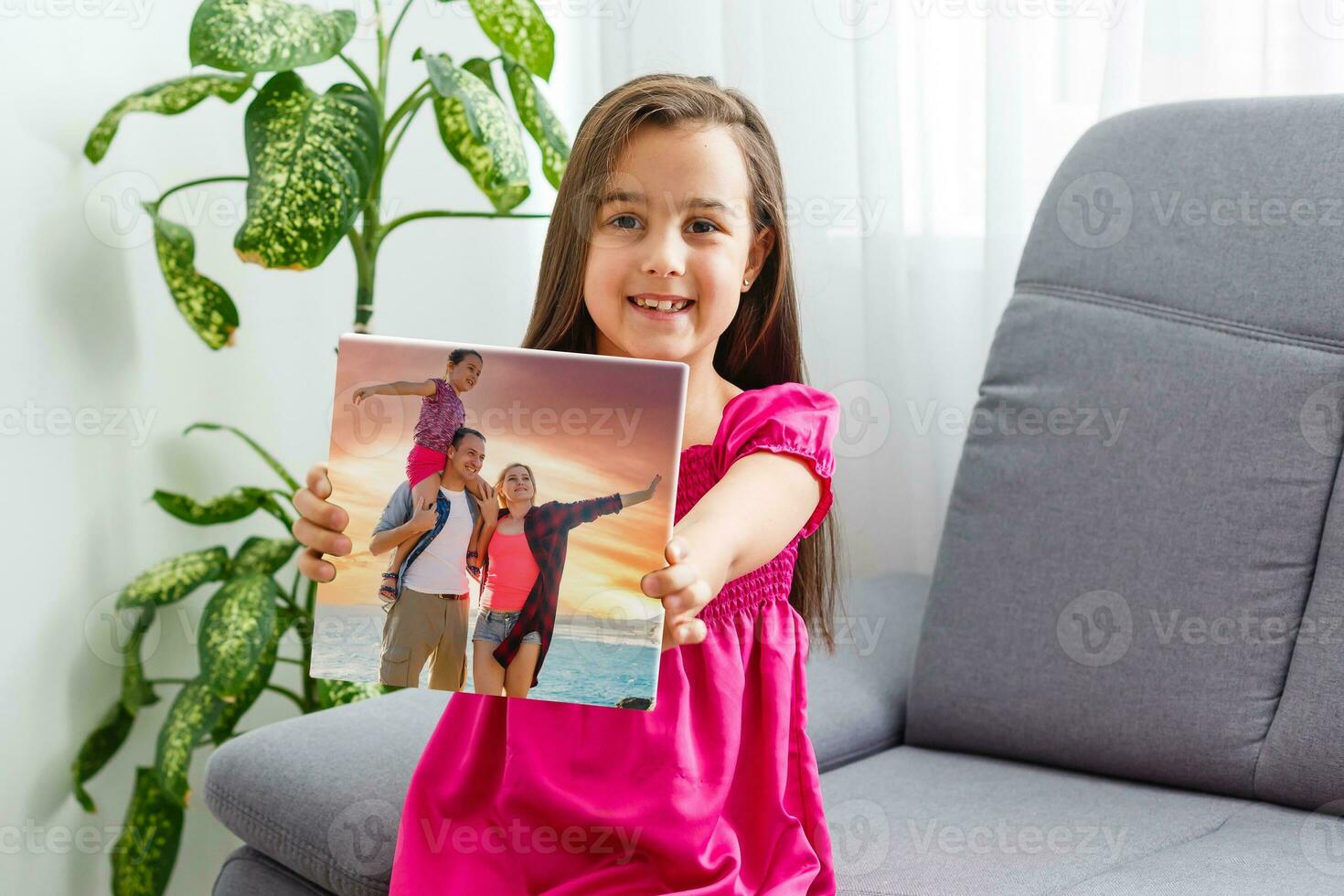 tradition to do a photo on each birthday. little girl with photos on canvas.