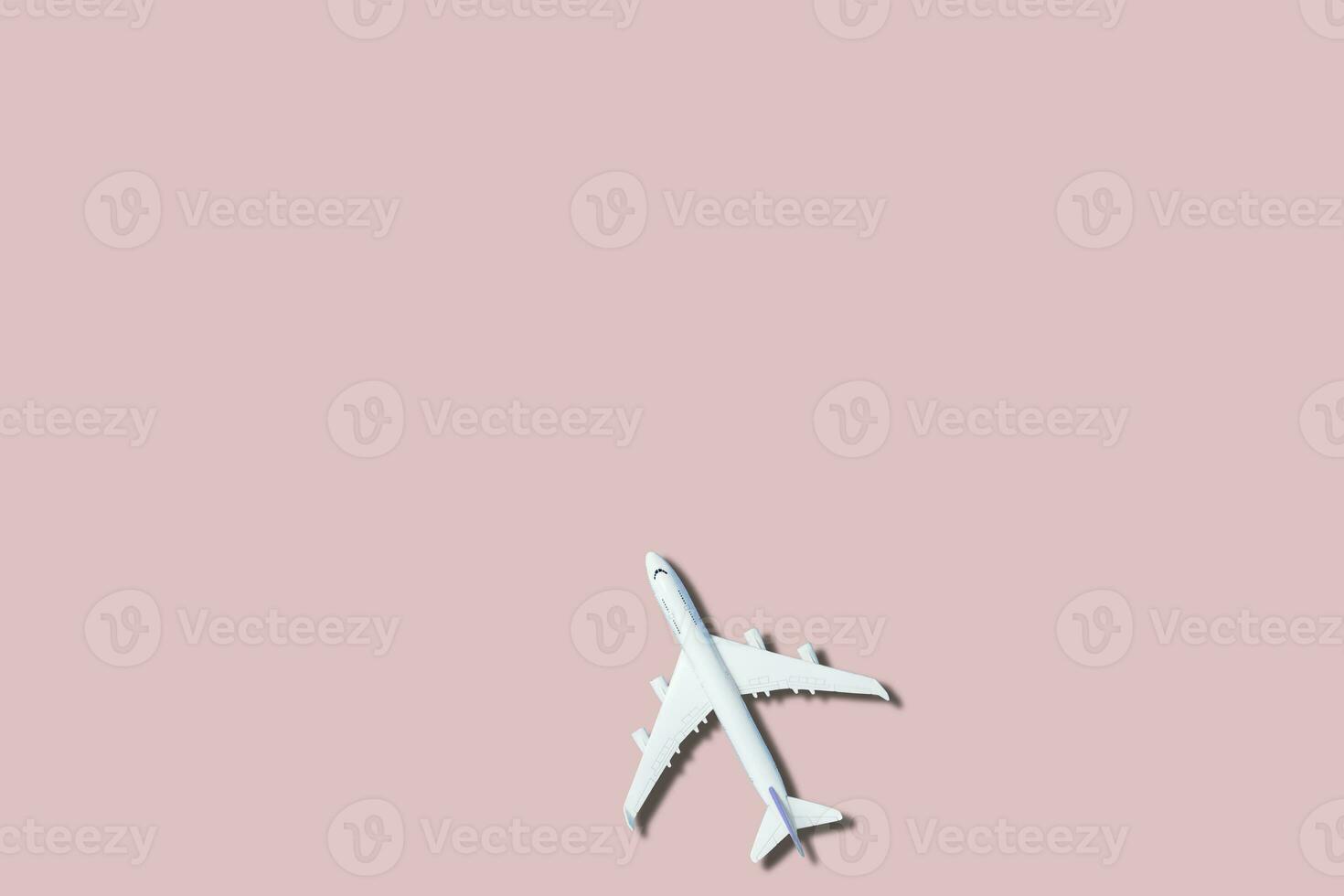 airplane figure on pink background photo