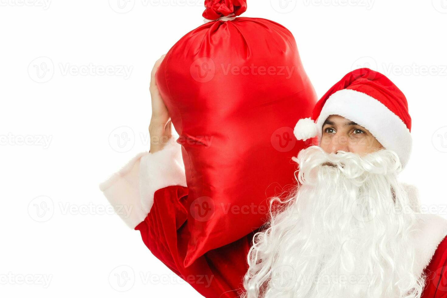 Santa claus holding a gifts against white background photo