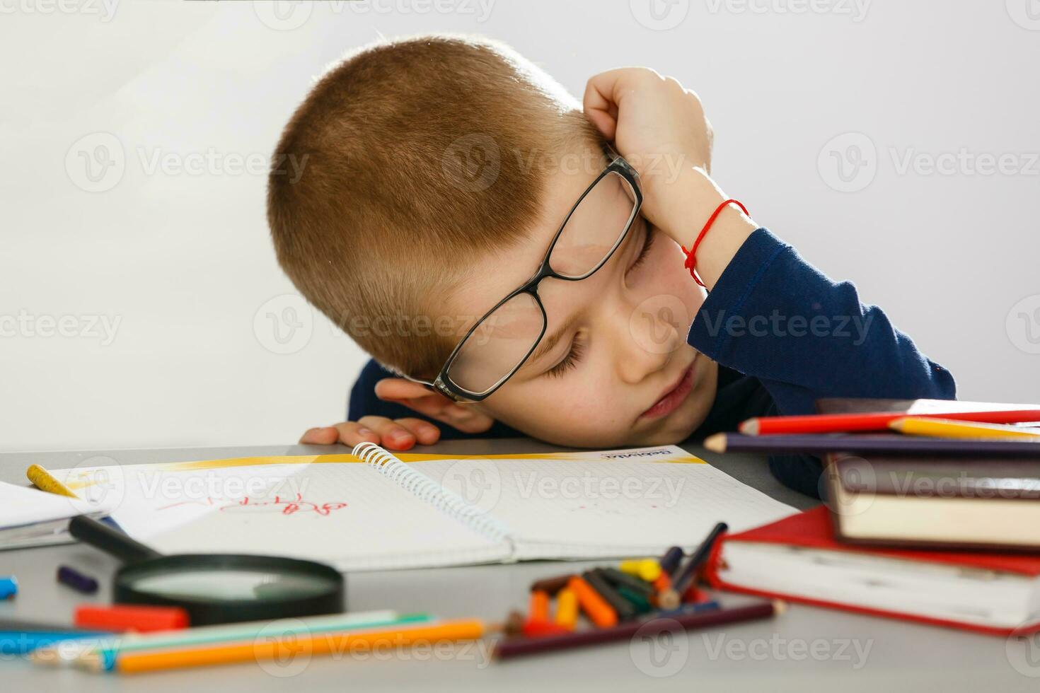 Child fell asleep during homework photo