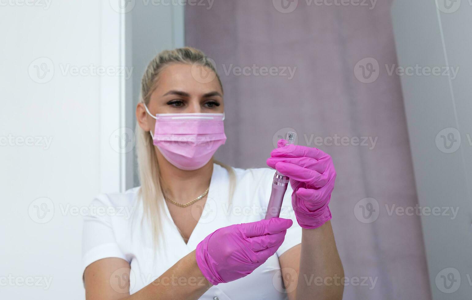 Mesotherapy And Microneedling Beauty Procedure. Closeup Real Female Aesthetician Holds Dermapen For Invasive Cosmetic Treatment Using Thin Needles. Microdermabrasion, Horizontal Plane photo