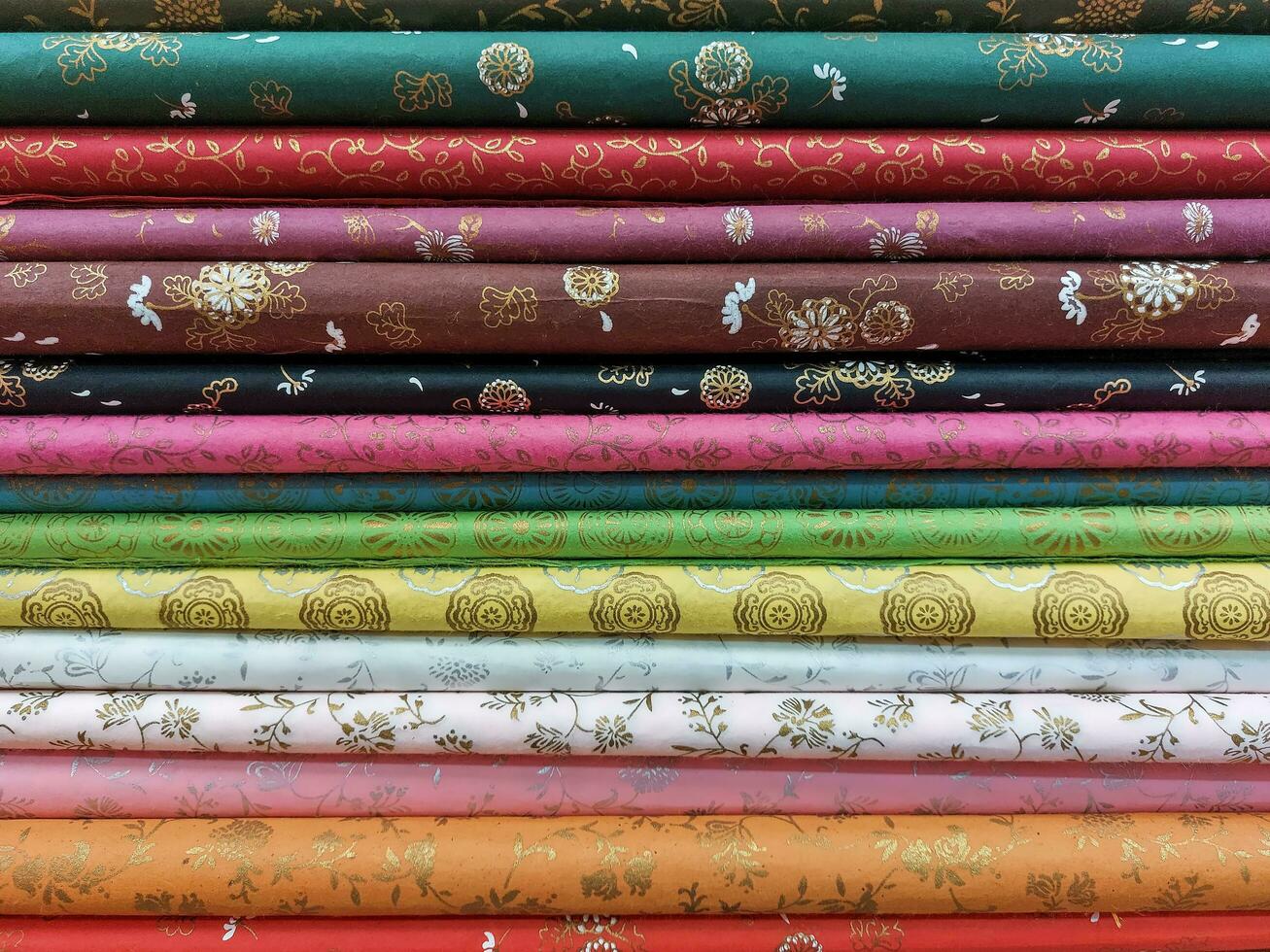 Floral fabrics and other patterns Fold and stack them in layers. photo