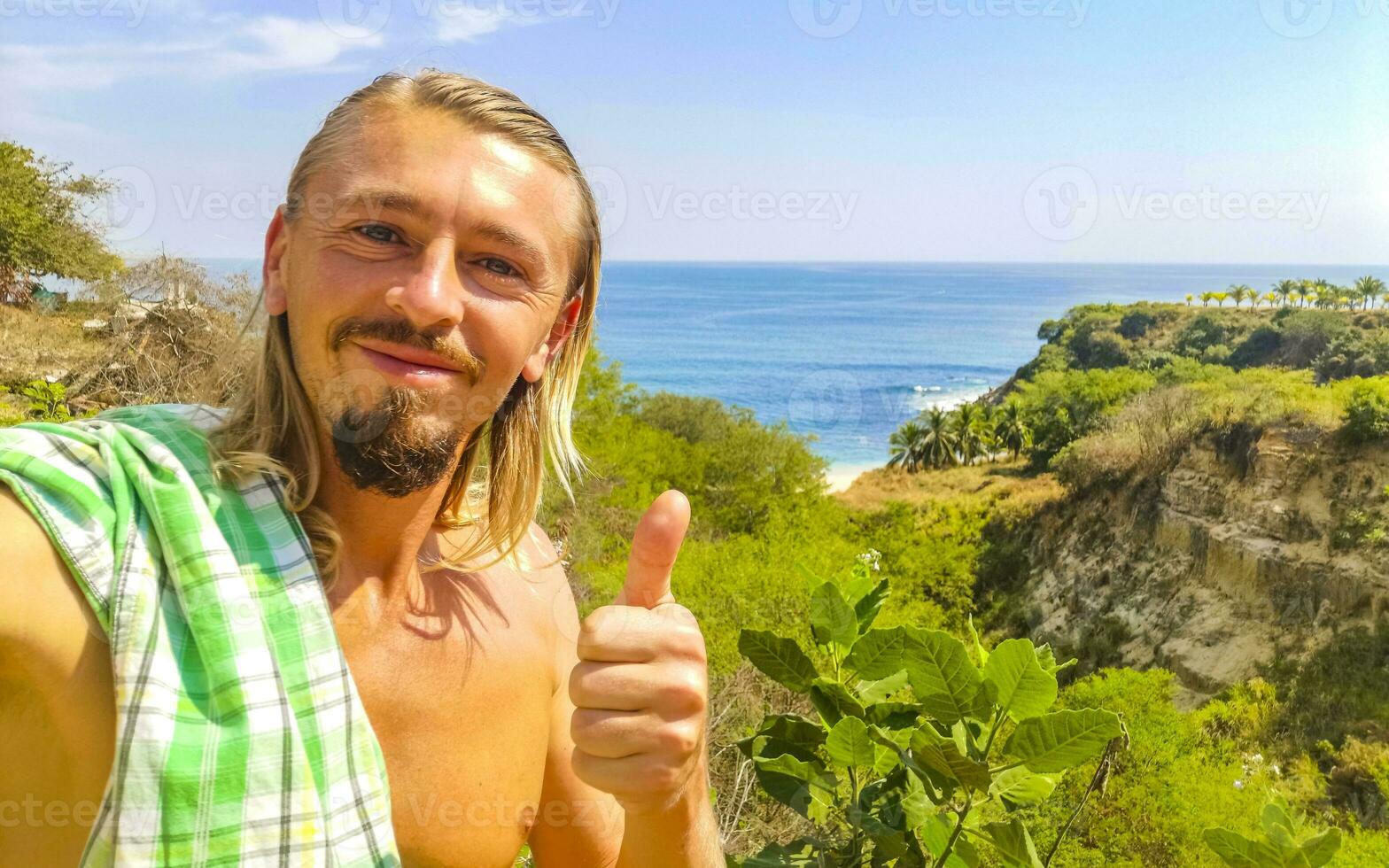 Selfie with rocks cliffs view waves beach Puerto Escondido Mexico. photo