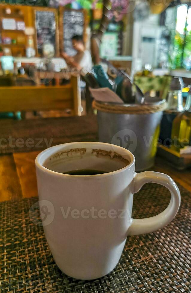 Cup of americano black coffee in restaurant cafe in Mexico. photo