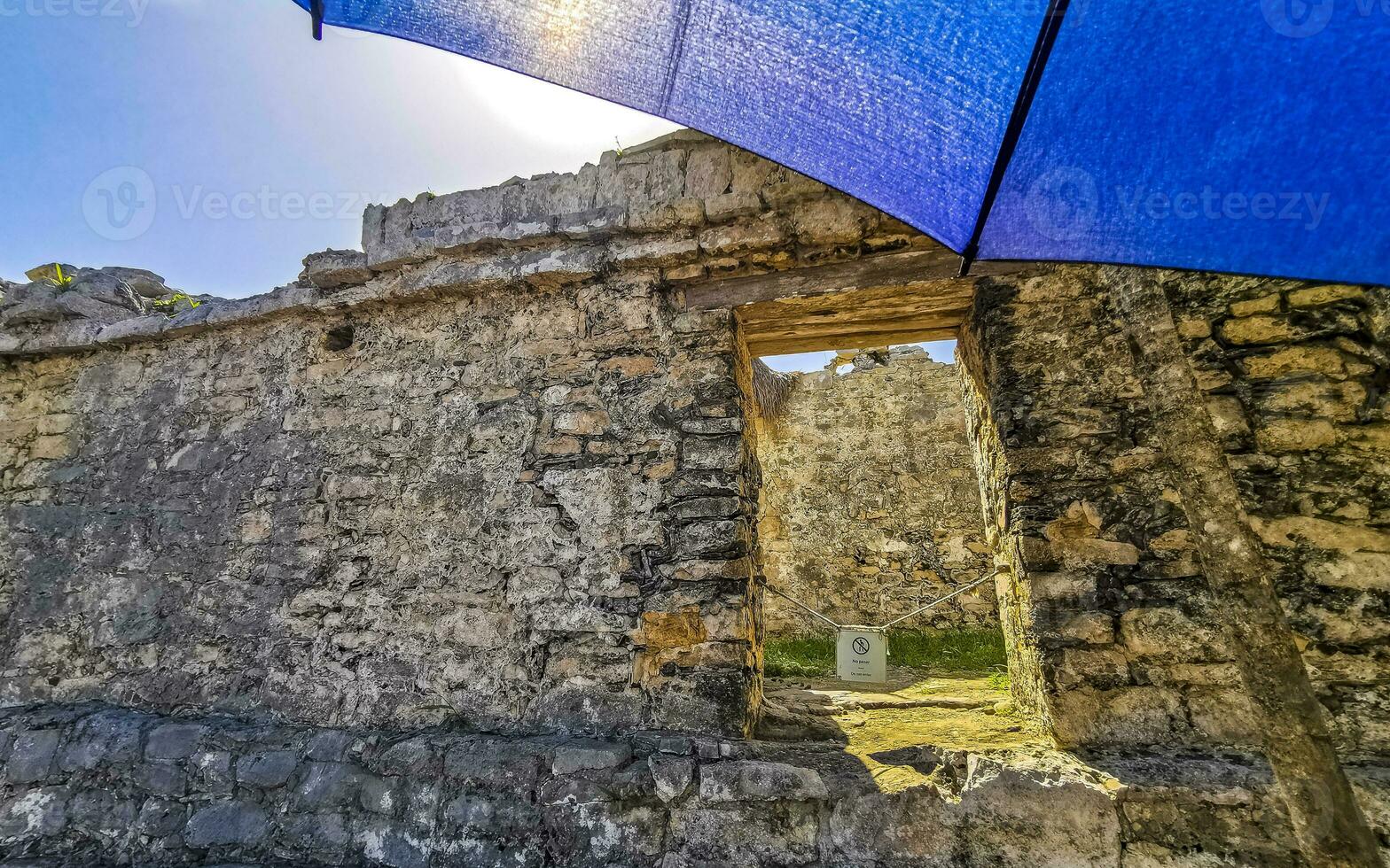 Ancient Tulum ruins Mayan site temple pyramids artifacts landscape Mexico. photo