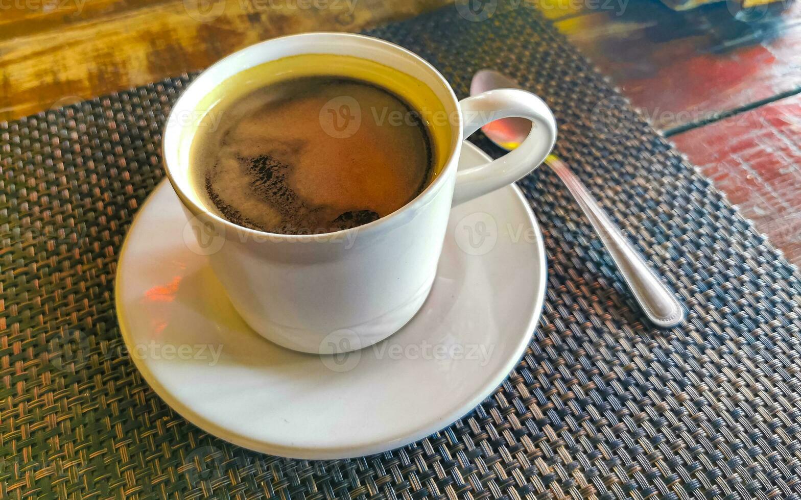 Cup of americano black coffee in restaurant cafe in Mexico. photo