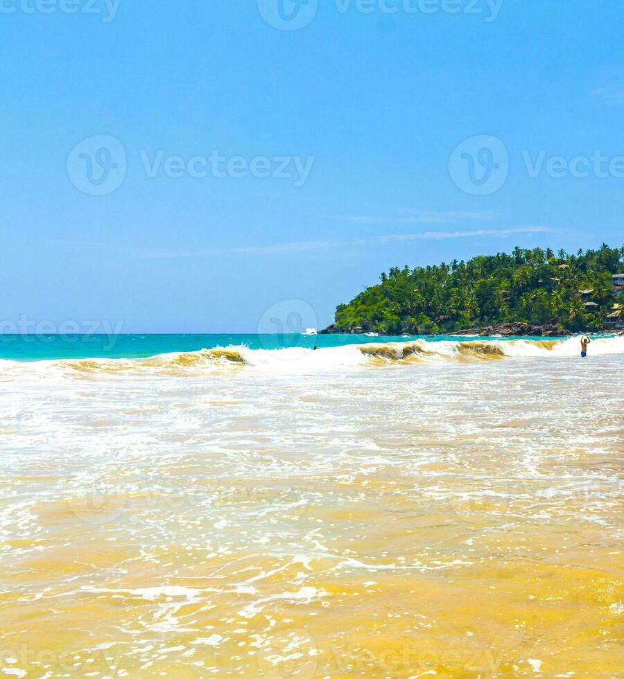 Beautiful paradise tropical beach waves palms Mirissa Beach Sri Lanka. photo