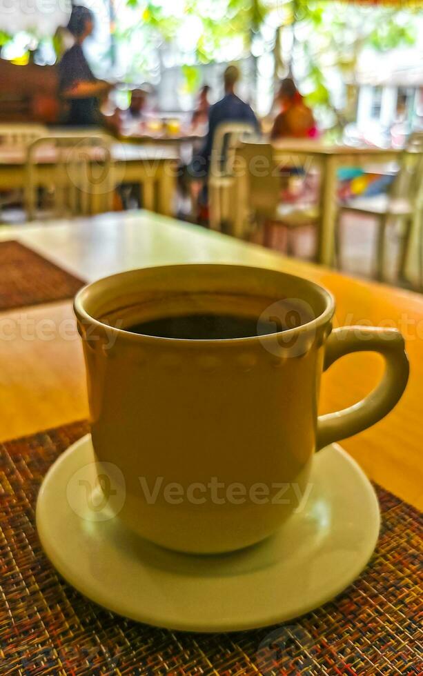 Cup of americano black coffee in restaurant cafe in Mexico. photo
