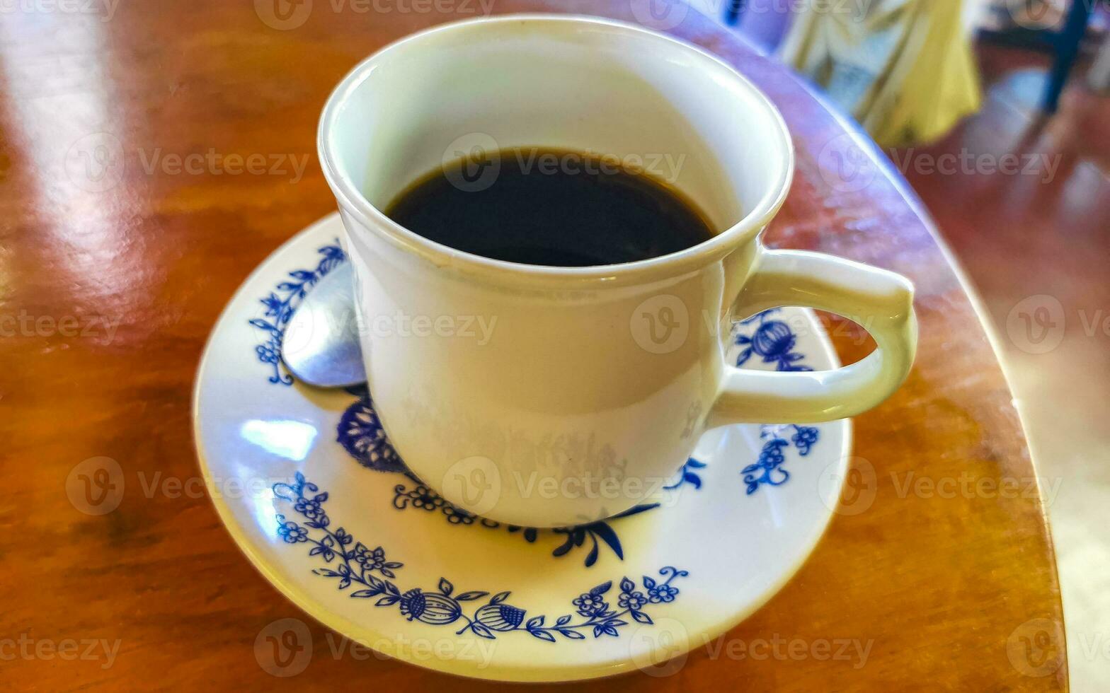 Blue white cup pot with black coffee wooden table Mexico. photo