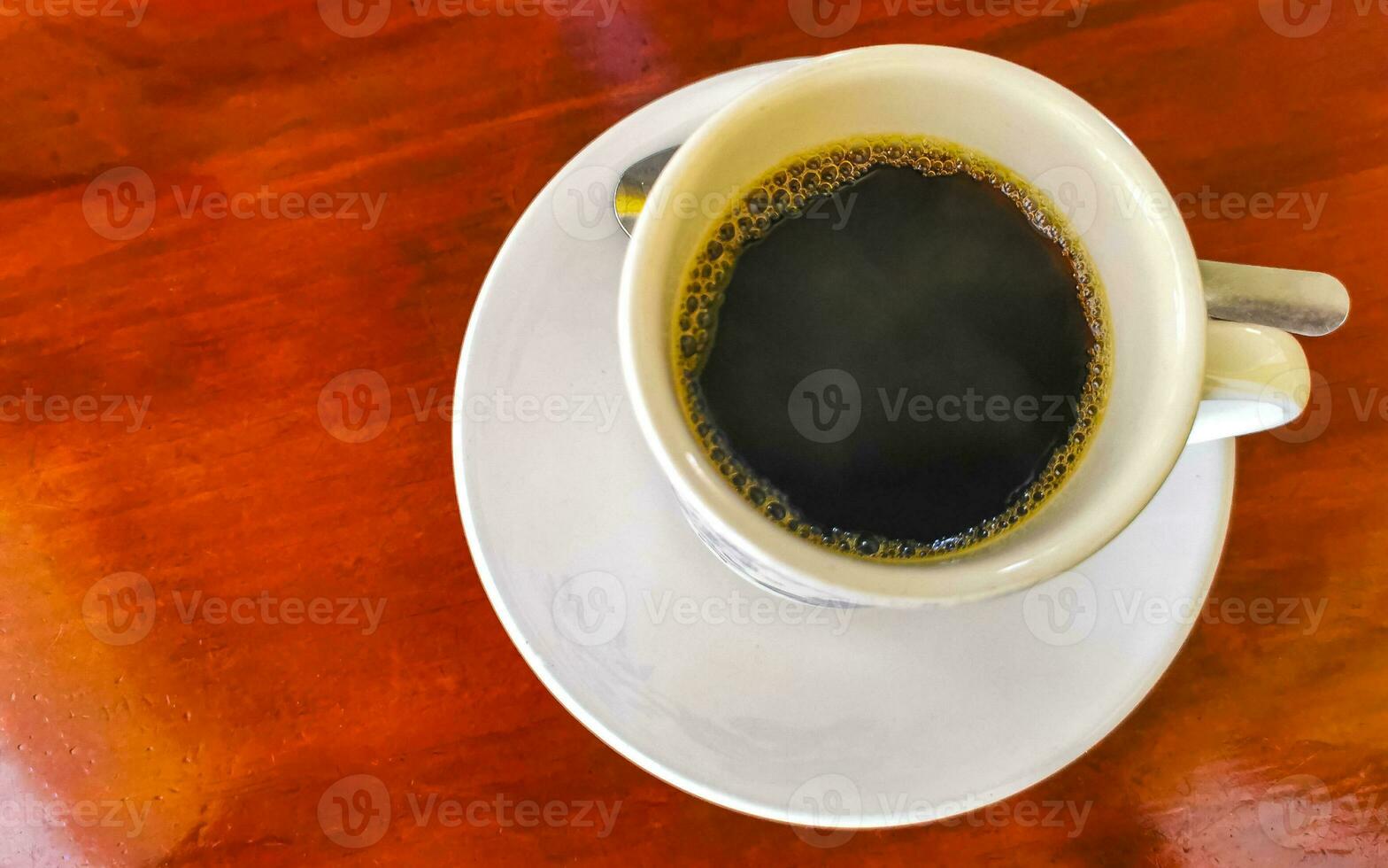 Cup of americano black coffee in restaurant Mexico. photo