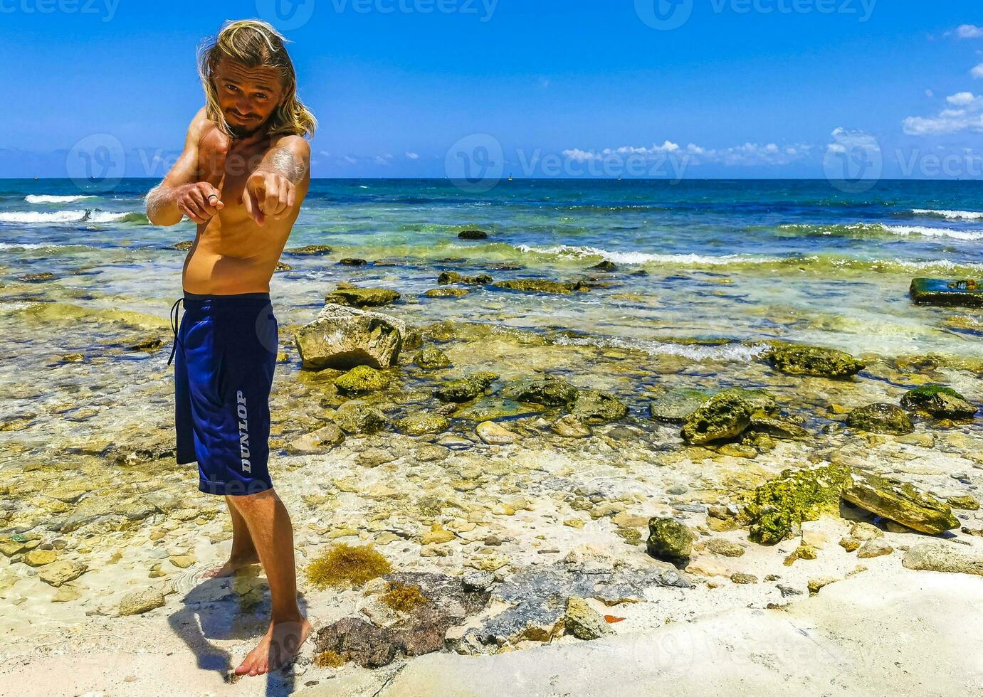 Male tourist Travelling man posing model Playa del Carmen Mexico. photo