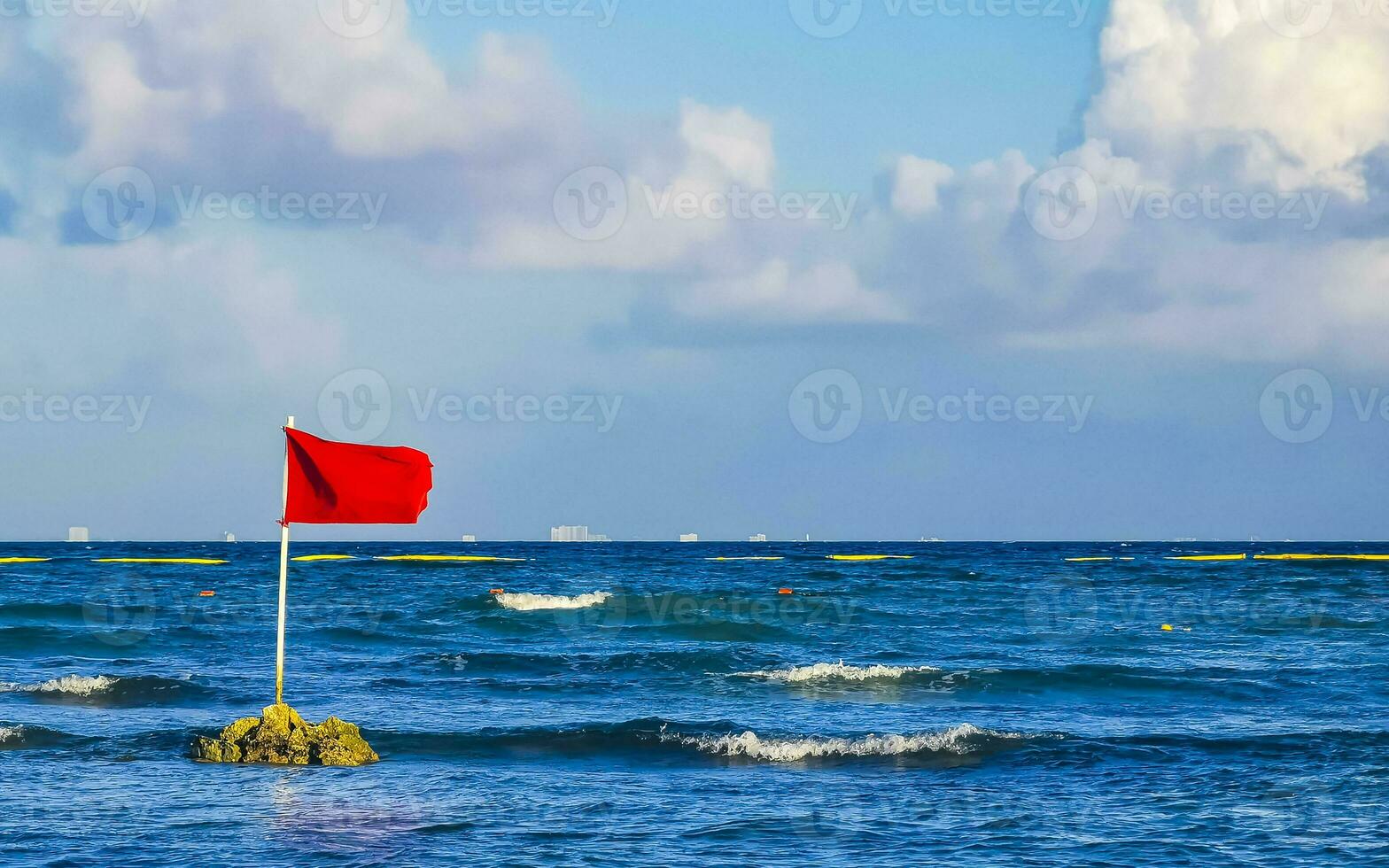 Red flag swimming prohibited high waves Playa del Carmen Mexico. photo