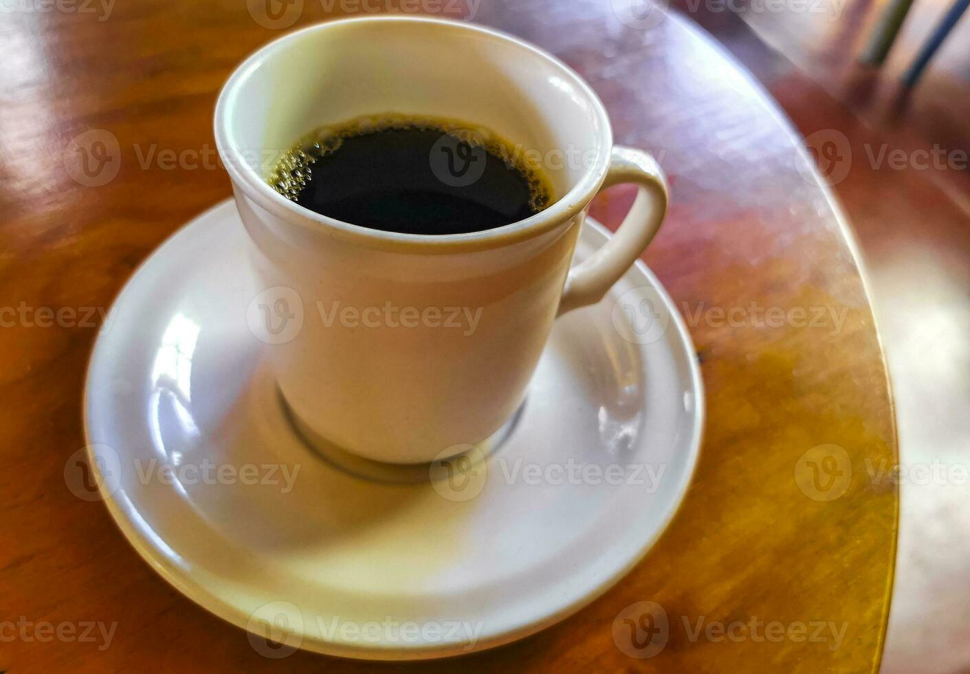 Cup of americano black coffee in restaurant Mexico. photo