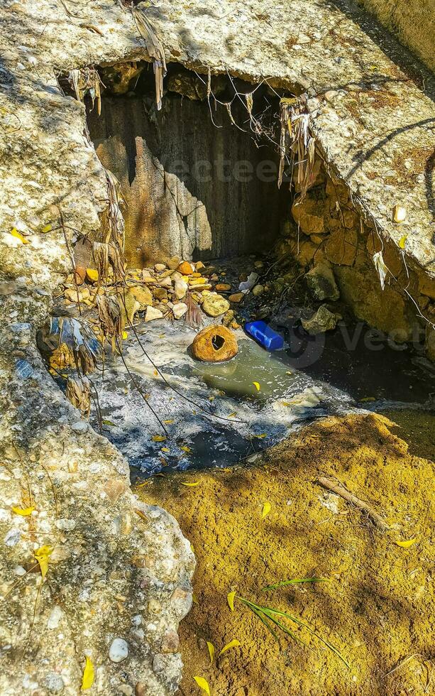 Open sewerage system in the tropical jungle mountains Mexico. photo