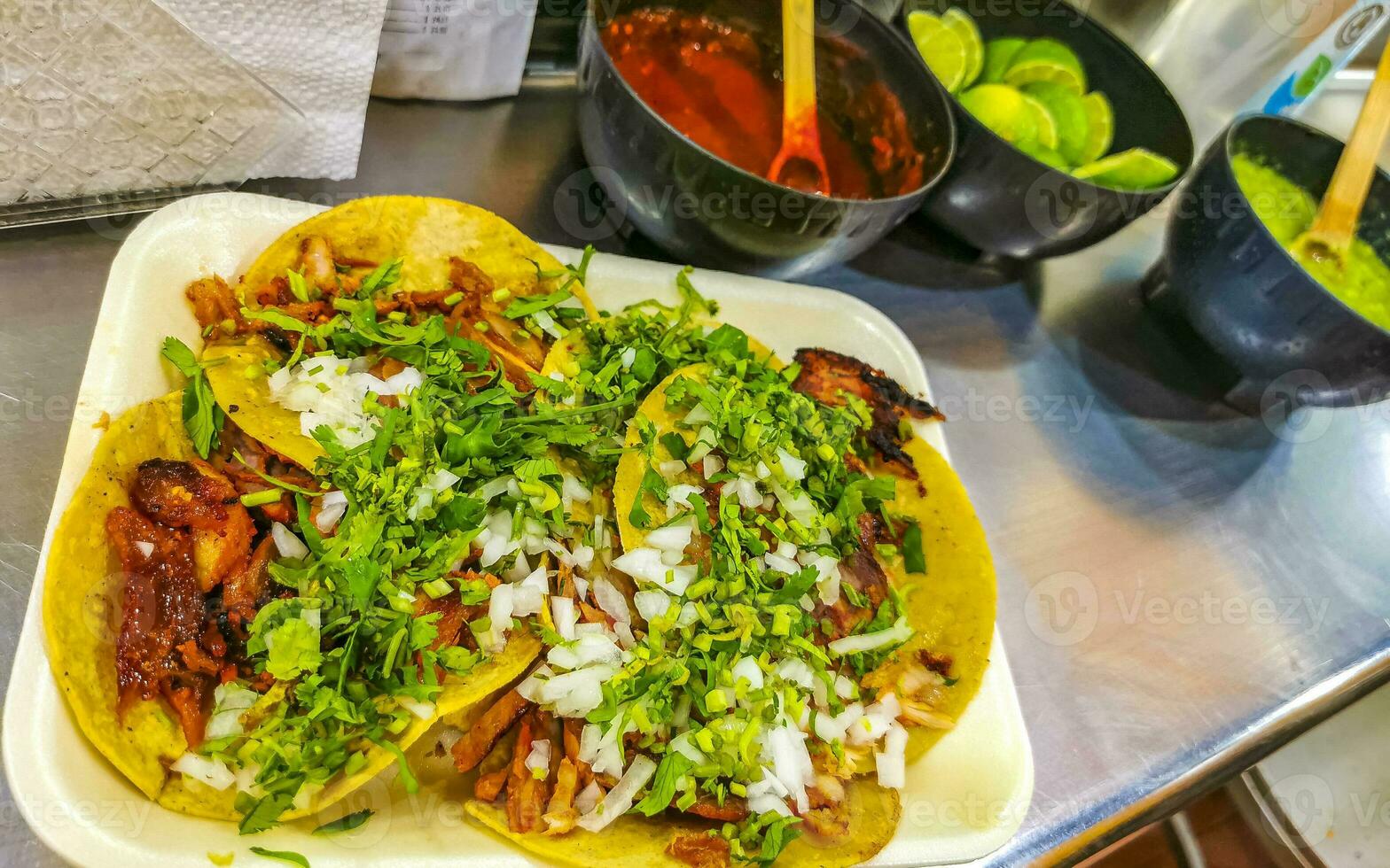 Mexican tacos with lime hot sauce pineapple and onions Mexico. photo