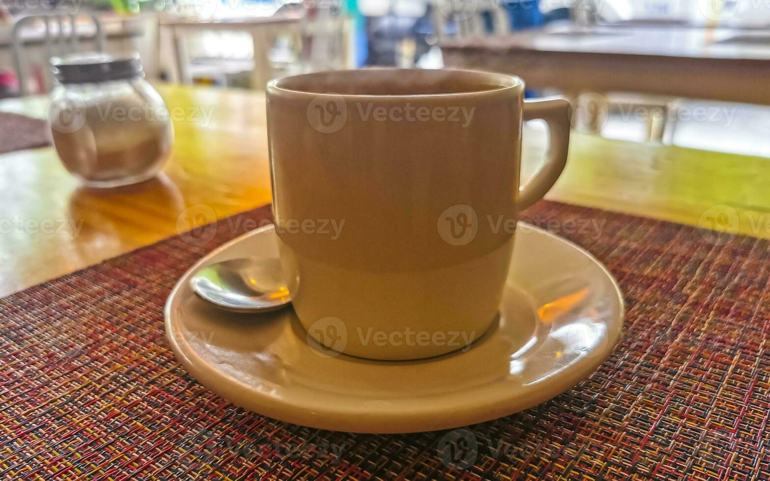 Cup of americano black coffee in restaurant cafe in Mexico. photo