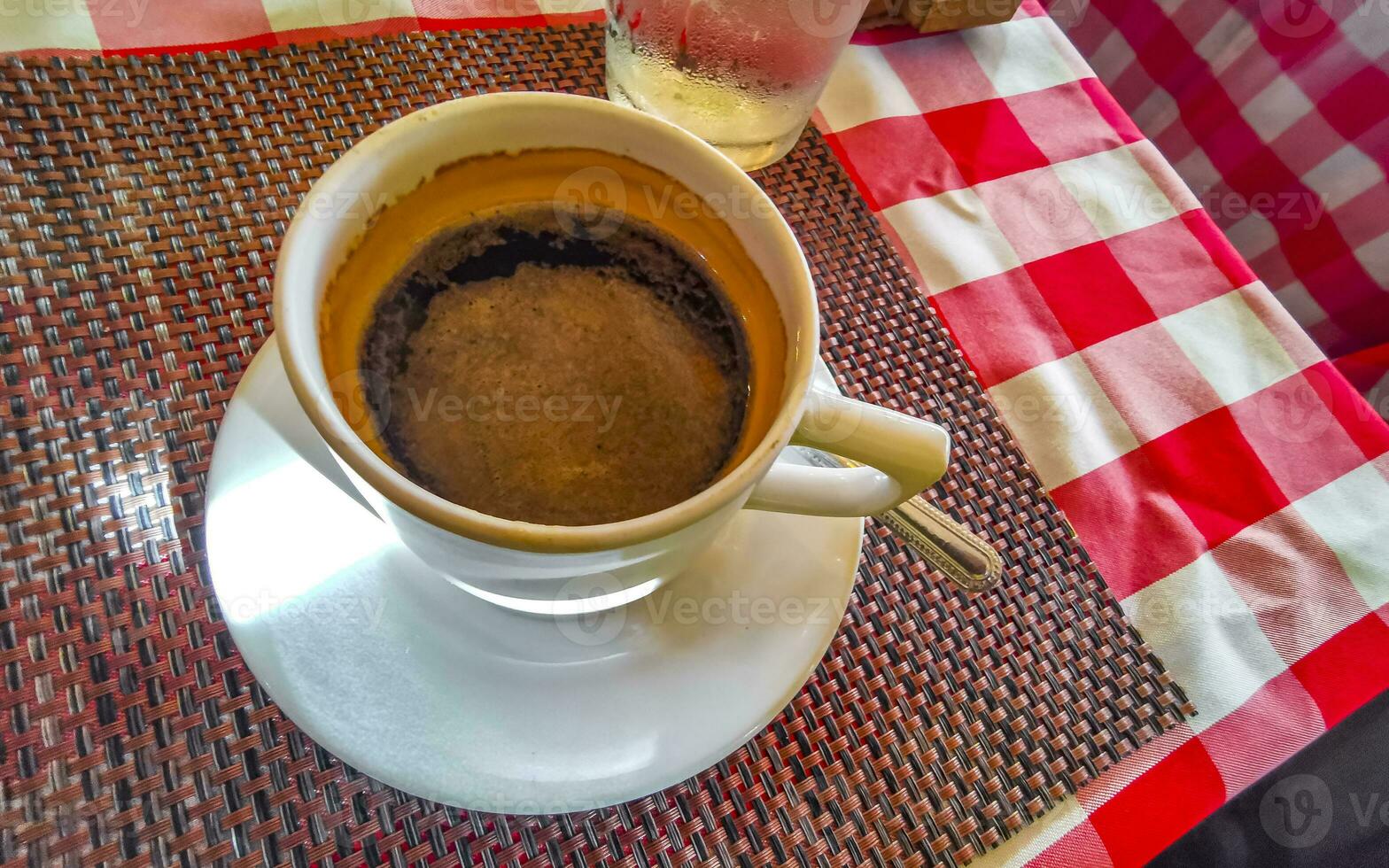 Cup of americano black coffee in restaurant cafe in Mexico. photo