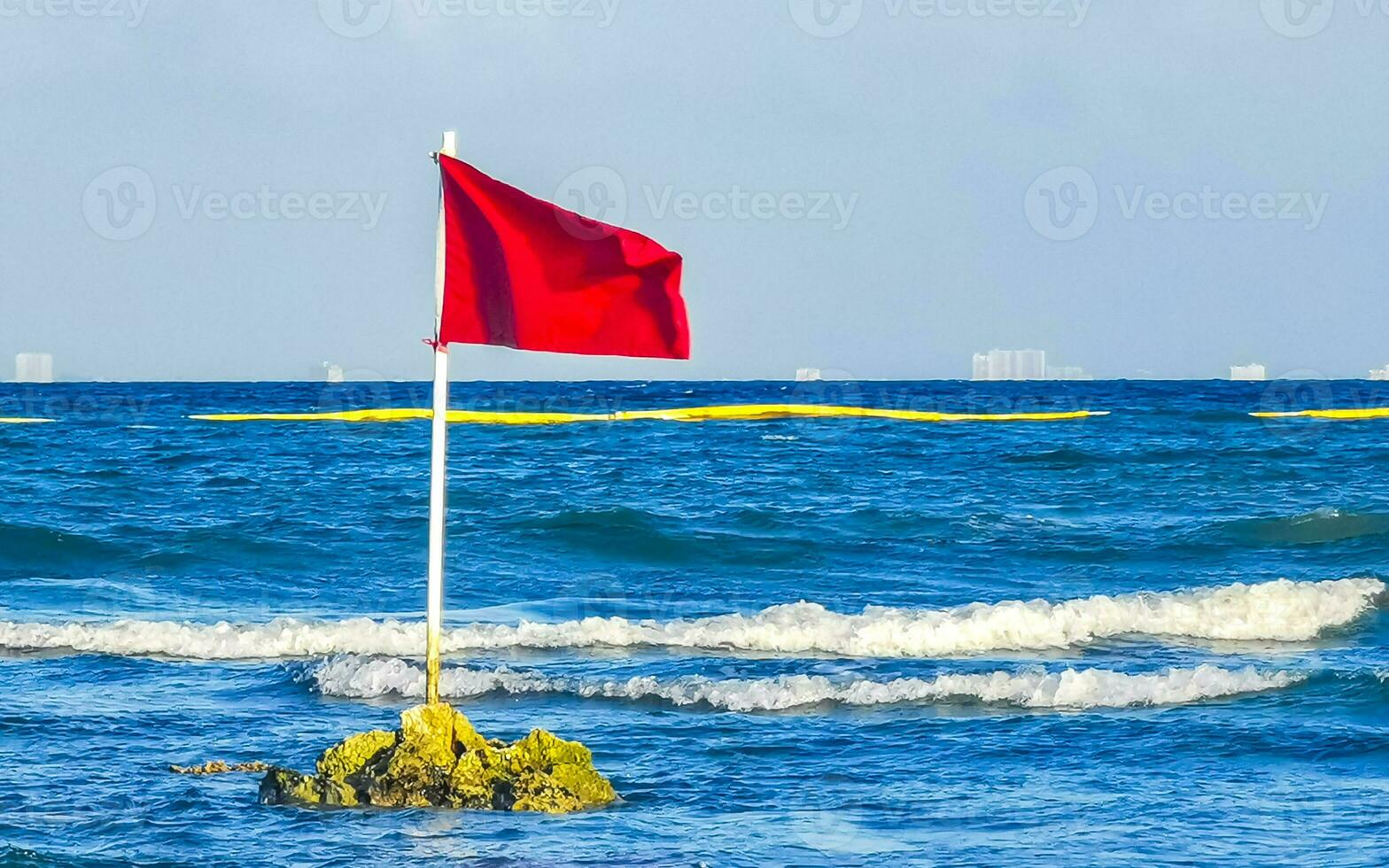 Red flag swimming prohibited high waves Playa del Carmen Mexico. photo