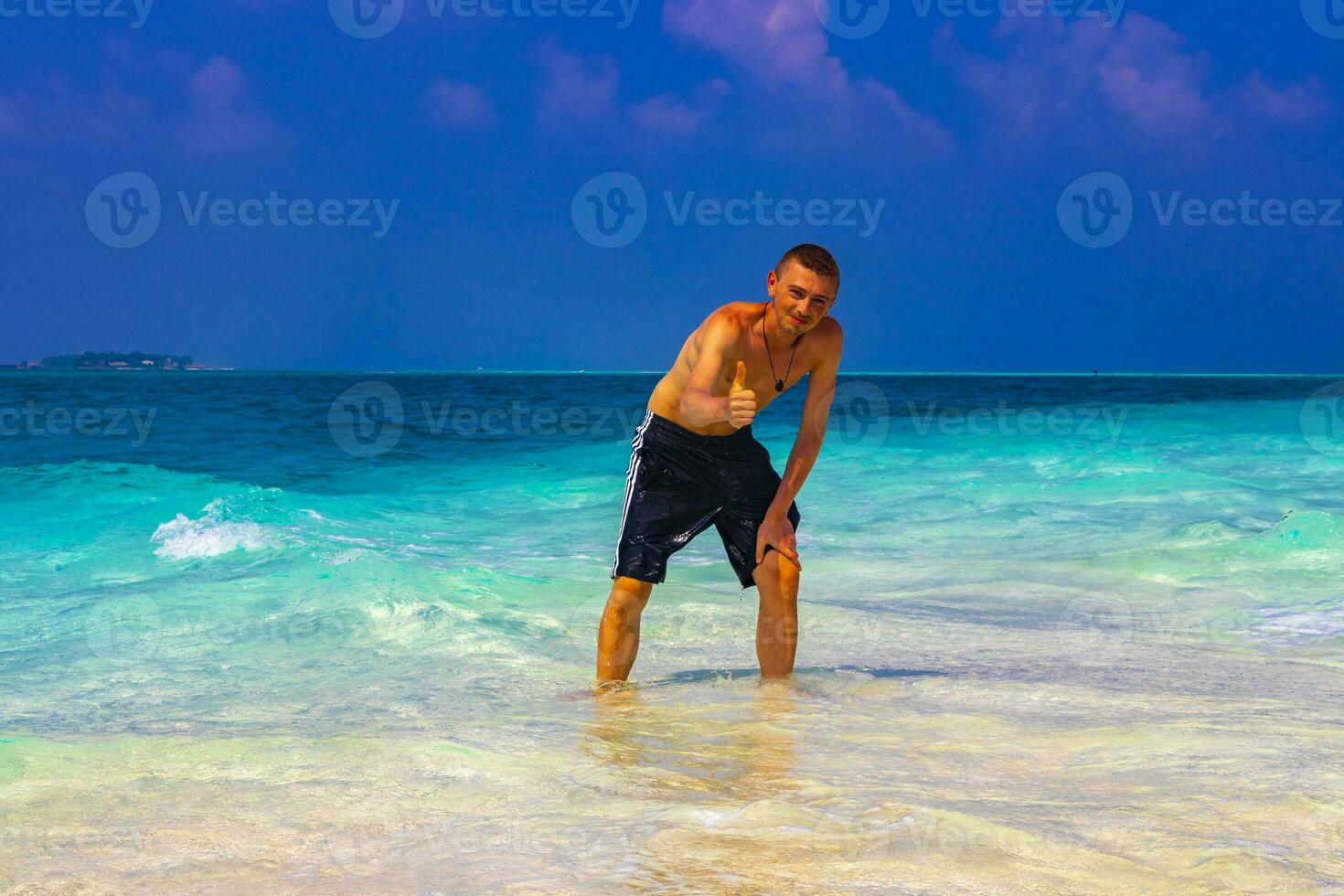 Male model tourist on island Madivaru Finolhu Rasdhoo Atoll Maldives. photo