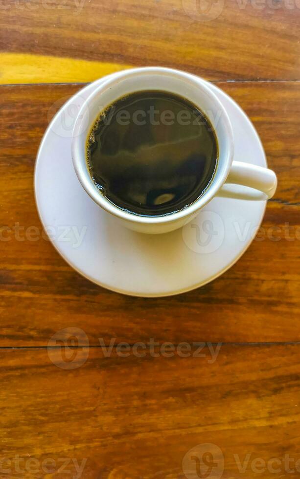 Cup of americano black coffee in restaurant Mexico. photo