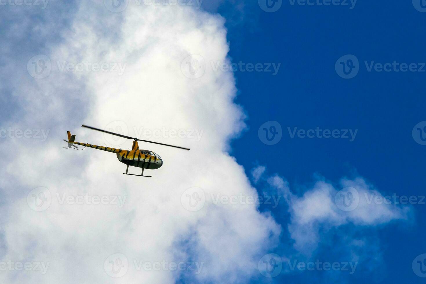 Tourist helicopter flies over the Caribbean Sea in Mexico. photo