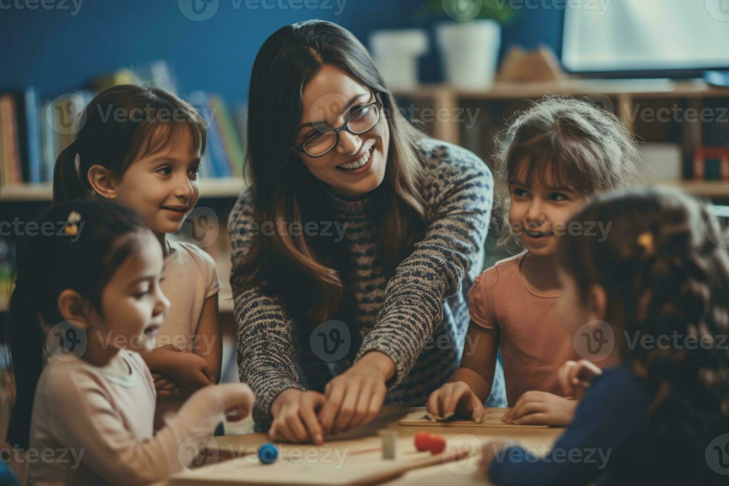 The teacher is teaching children at school photo