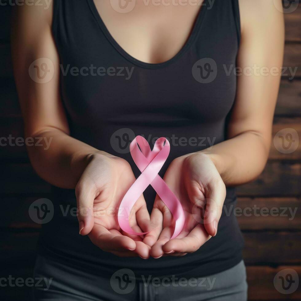 Pink ribbon on wood photo