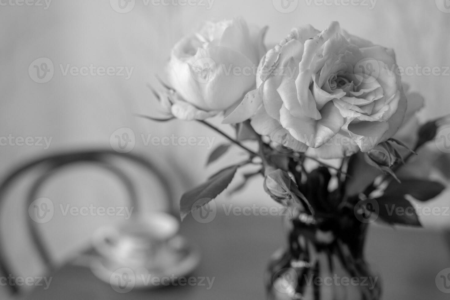 Photography to theme beautiful bouquet roses in vase on wooden table photo