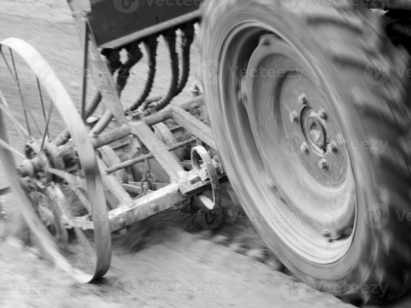 Plowed field by tractor in black soil on open countryside nature photo