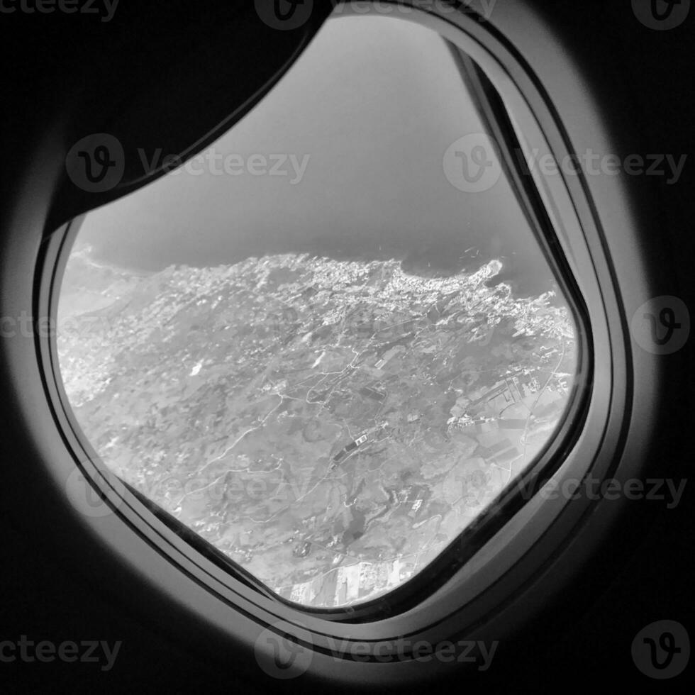 Beautiful view from airplane window, large wing of aircraft shows casement photo