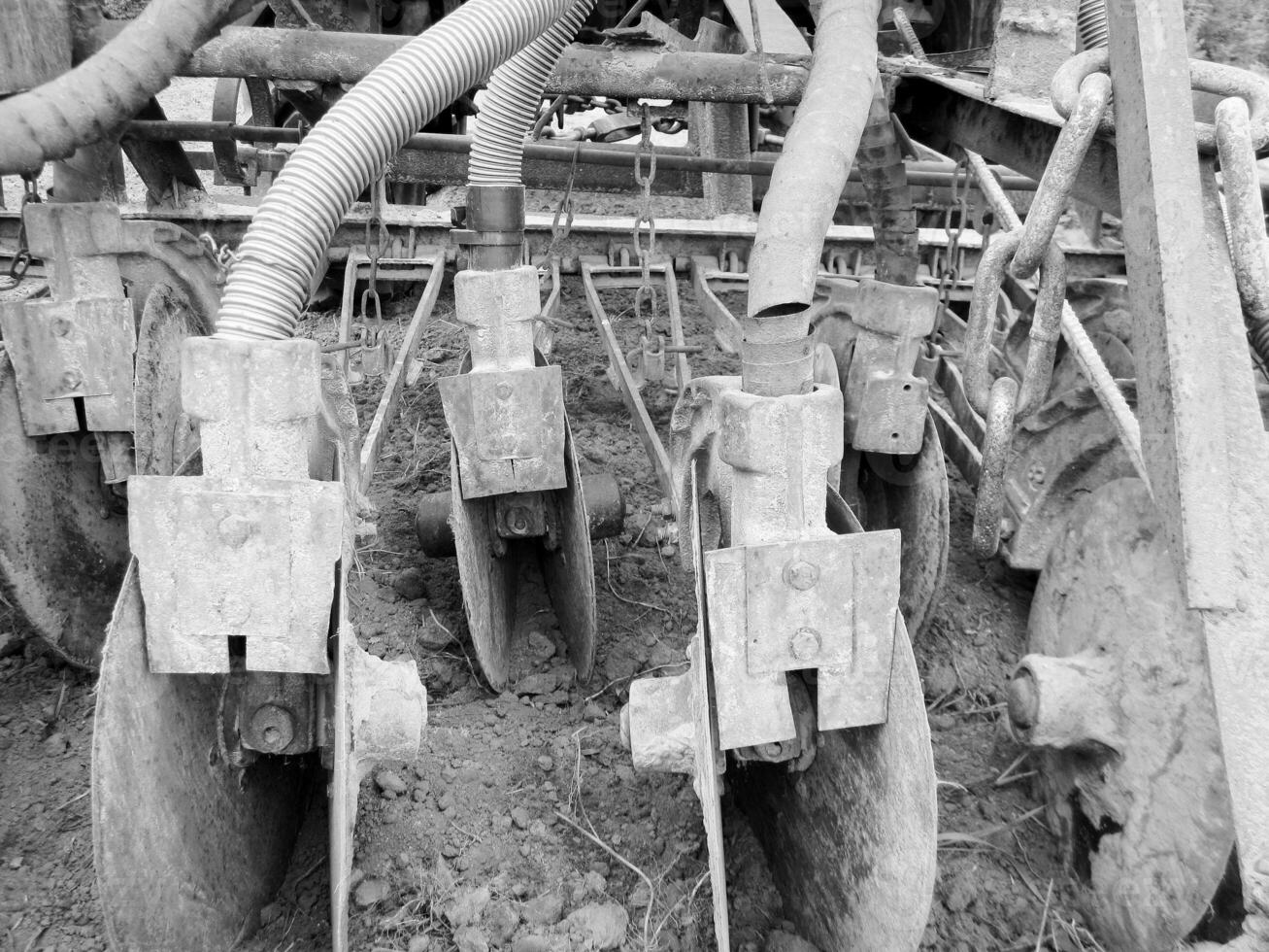 Plowed field by tractor in black soil on open countryside nature photo