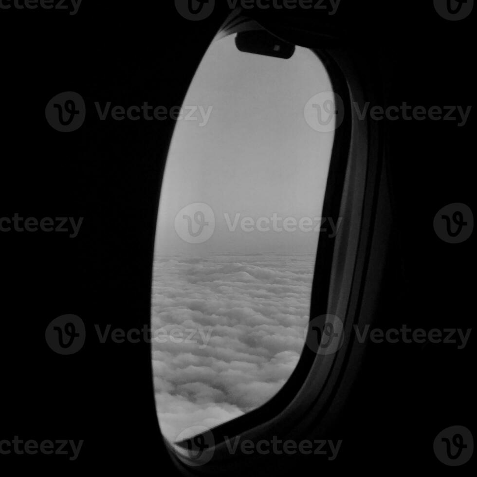 Beautiful view from airplane window, large wing of aircraft shows casement photo