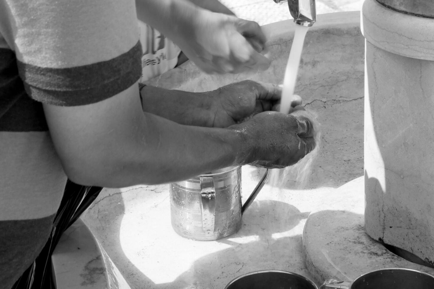 Crane with water and special ritual cups photo