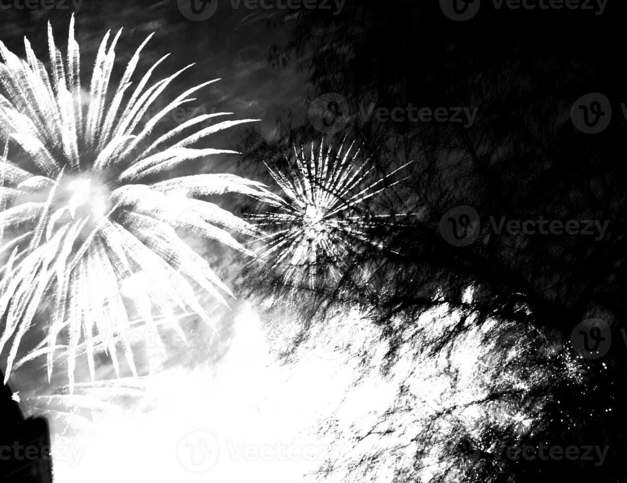 Burst colorful fireworks in night dark sky photo