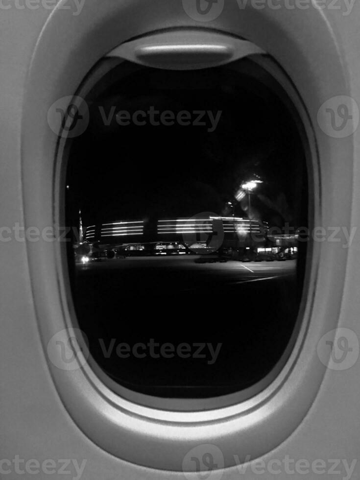 Beautiful view from airplane window, large wing of aircraft shows casement photo