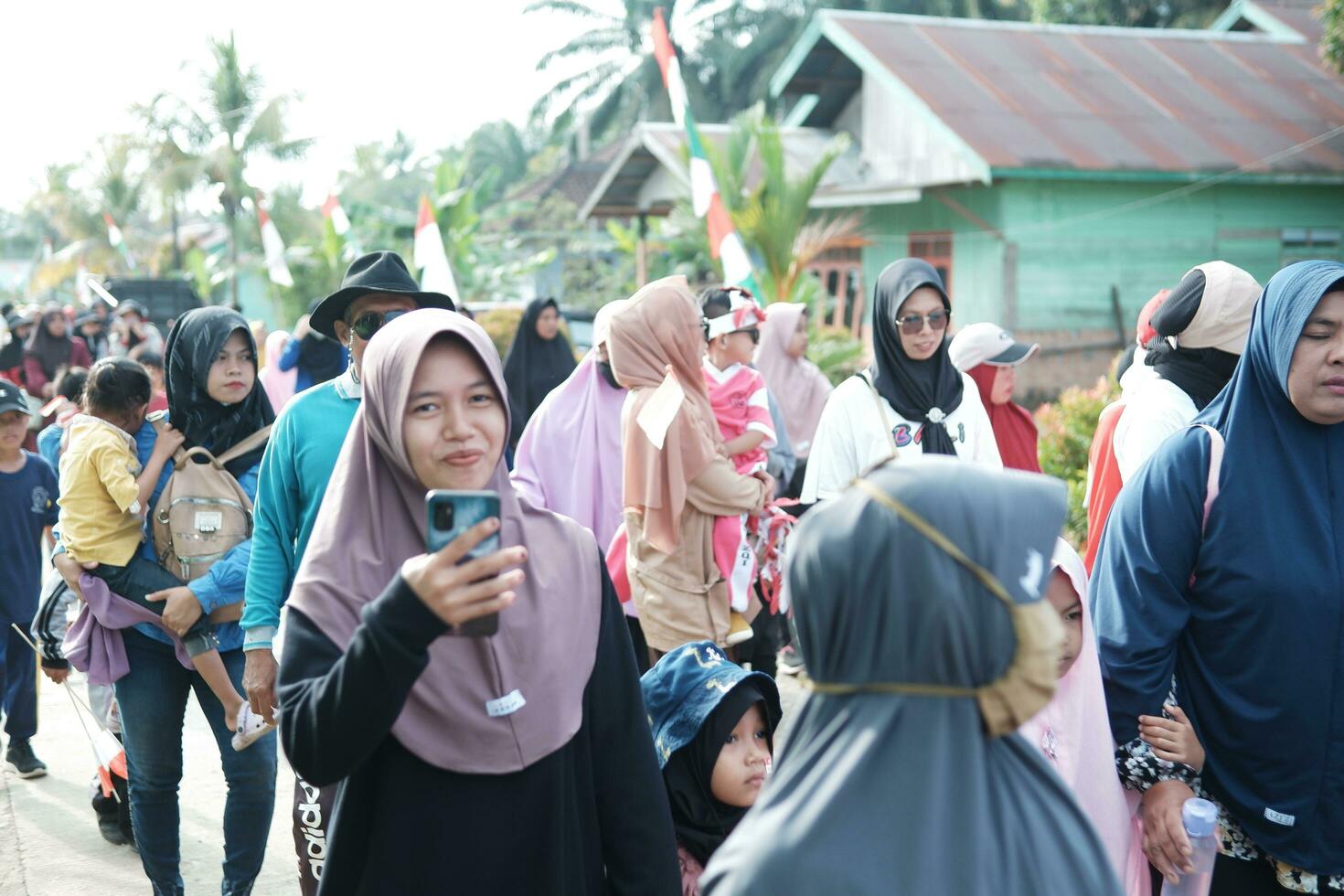 Kuaro Kalimantan Timur, Indonesia 17 August 2023. Celebrate the 78th Indonesian Independence Day with the villagers doing healthy walks photo