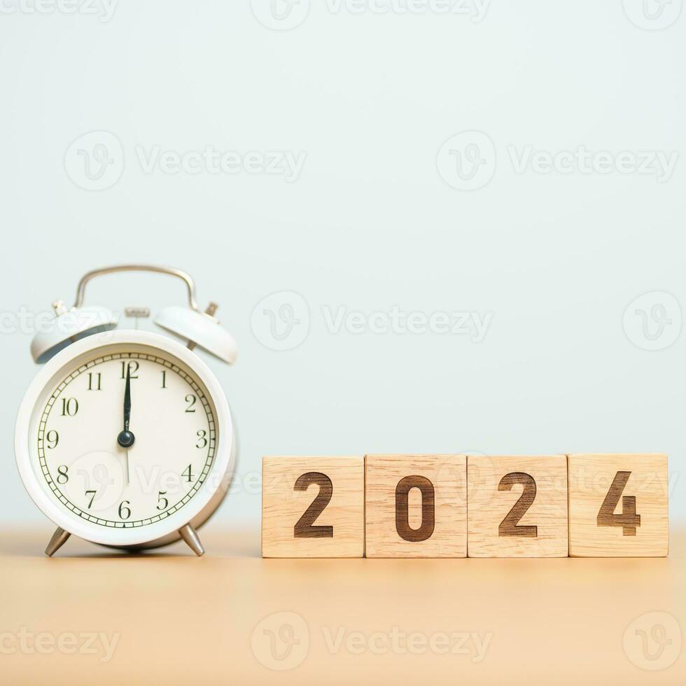 Happy New Year with vintage alarm clock and 2024 block. Christmas, New Start, Resolution, countdown, Goals, Plan, Action and Motivation Concept photo