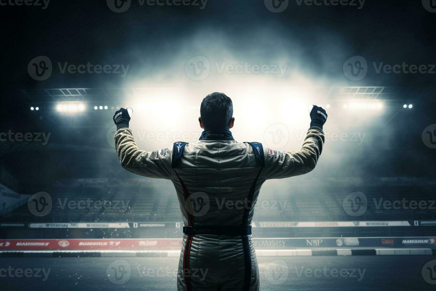Race car driver express their joy at winning the race by raising their fists in the air photo